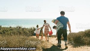 Family walking to beach